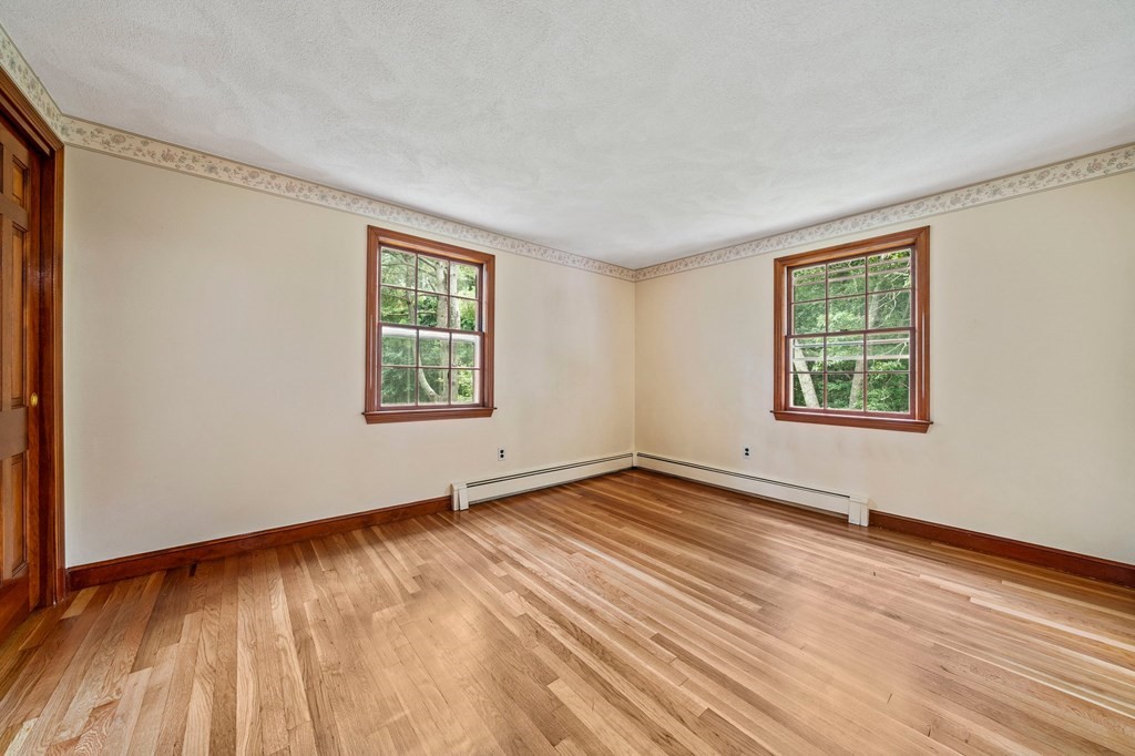 3 Winfield Road Hingham, MA 02043 - Photo 22 of 39 a view of an empty room with wooden floor and a window