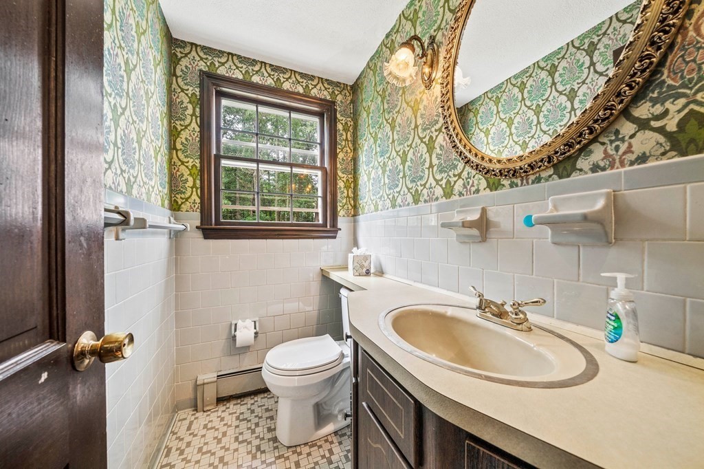 3 Winfield Road Hingham, MA 02043 - Photo 28 of 39 a bathroom with a sink a toilet and a mirror