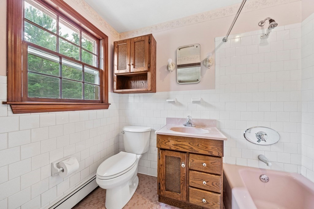 3 Winfield Road Hingham, MA 02043 - Photo 29 of 39 a bathroom with a granite countertop toilet sink and mirror