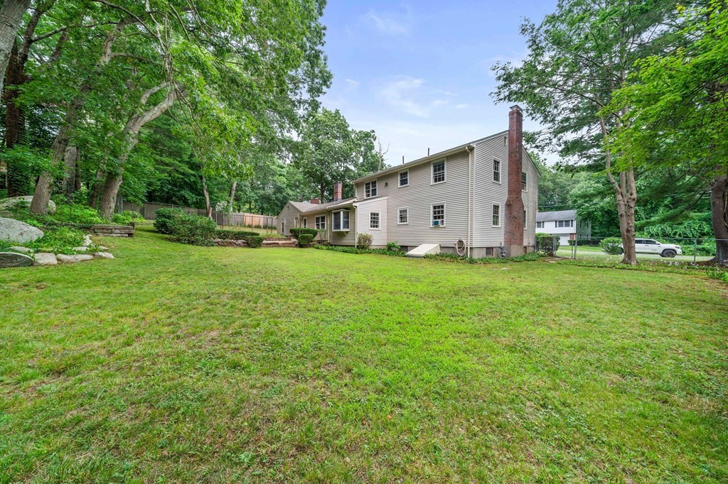3 Winfield Road Hingham, MA 02043 - Photo 36 of 39 a white house with a small yard and large trees