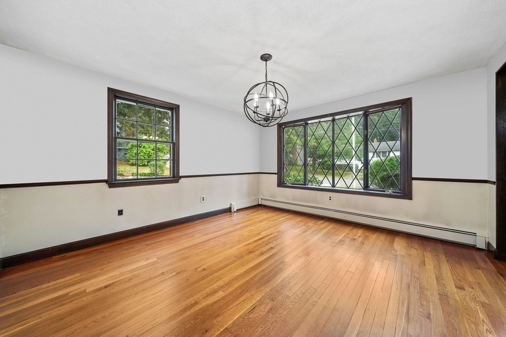 3 Winfield Road Hingham, MA 02043 - Photo 6 of 39 a view of an empty room with wooden floor and a window