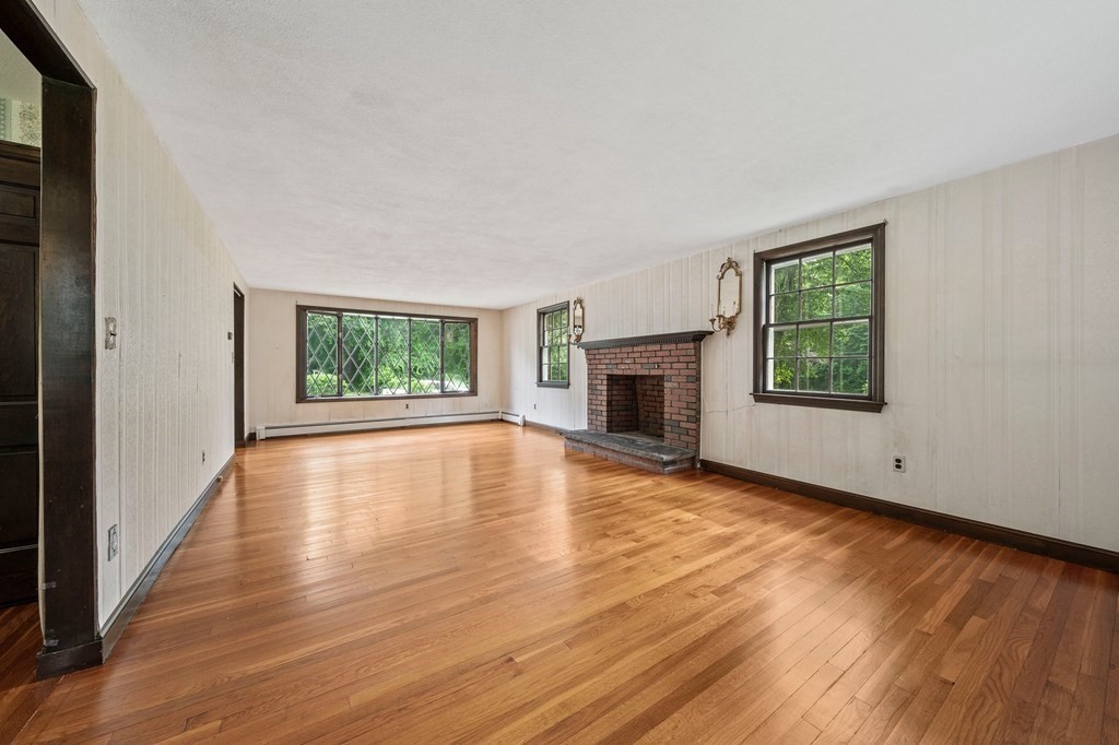 3 Winfield Road Hingham, MA 02043 - Photo 10 of 39 a view of an empty room with wooden floor and a window