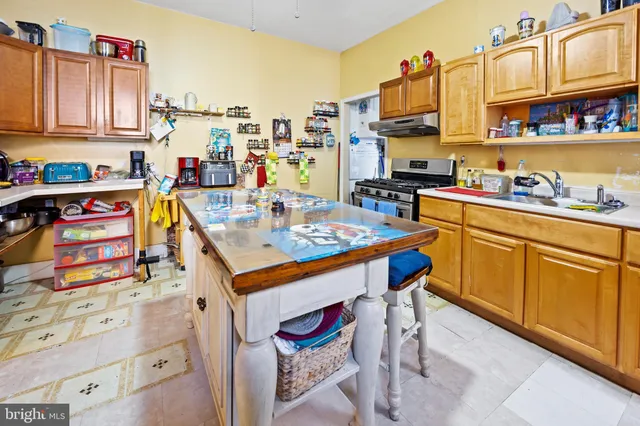 a kitchen with a cabinets and appliances