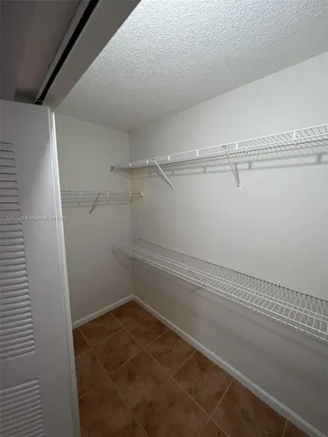 a view of a room with racks on the wall