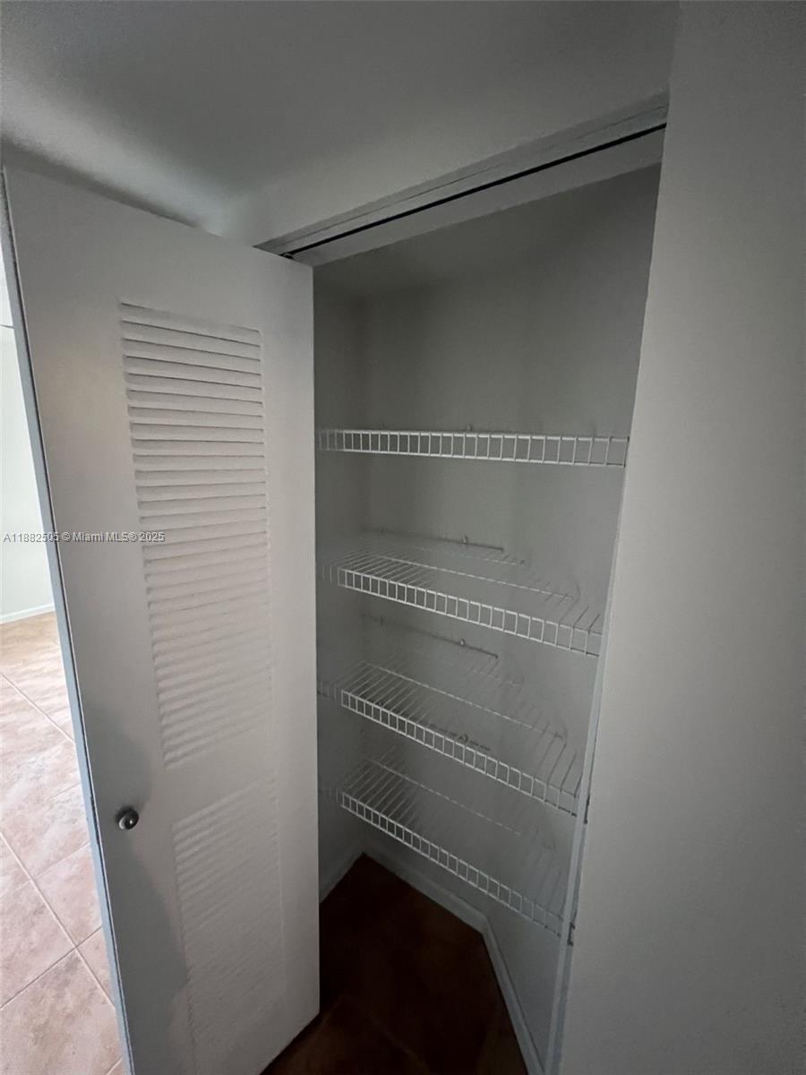 1919 Van Buren Street, Unit 408A Hollywood, FL 33020 - Photo 10 of 19 a view of walk in closet