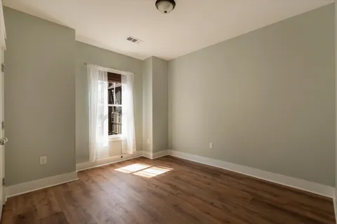 a view of a house with a yard porch and sitting area