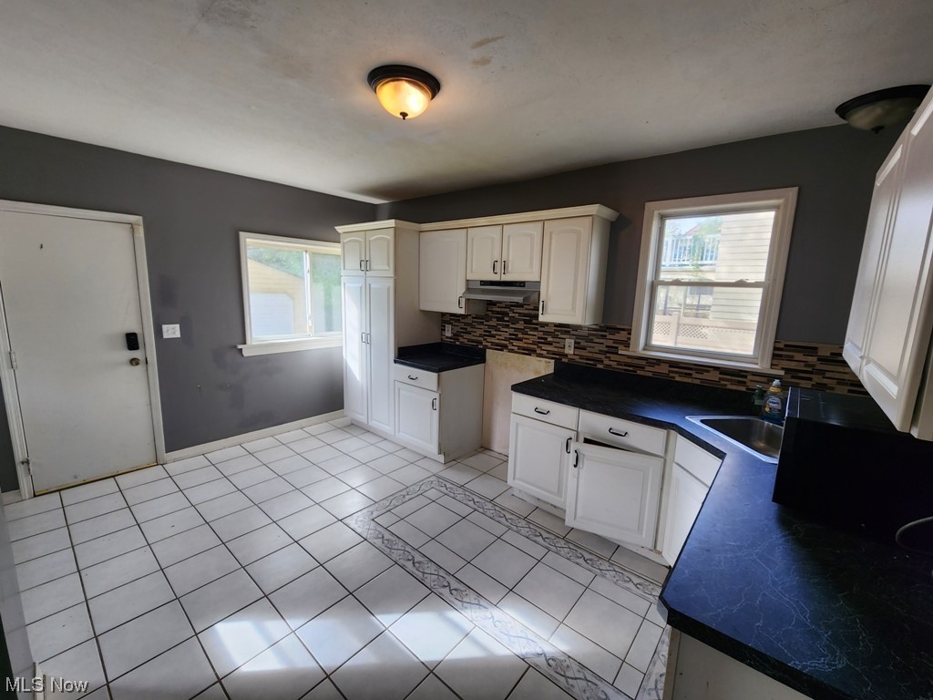 3602 Silsby Road University Heights, OH 44118 - Photo 3 of 19 Kitchen featuring light tile flooring, backsplash, and plenty of natural light