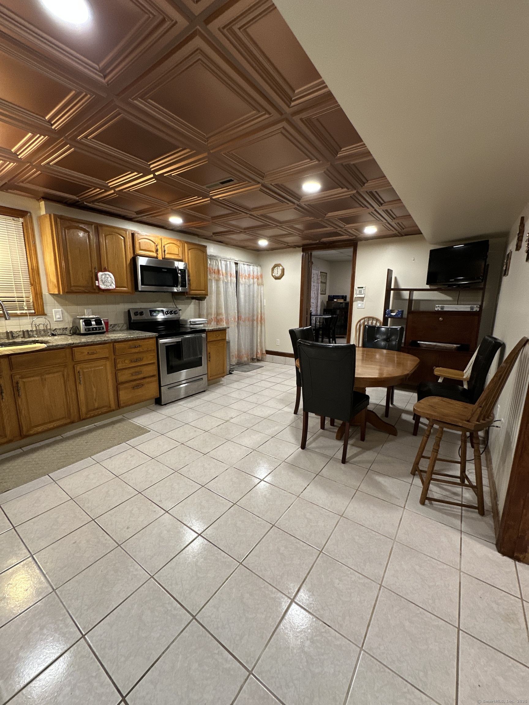 a kitchen with furniture cabinets and stainless steel appliances