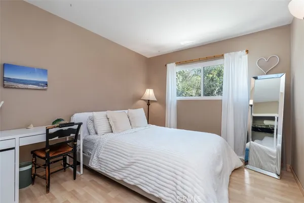 a bedroom with a bed and a table in it