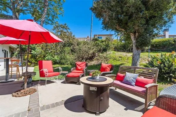 a view of a garden with a house