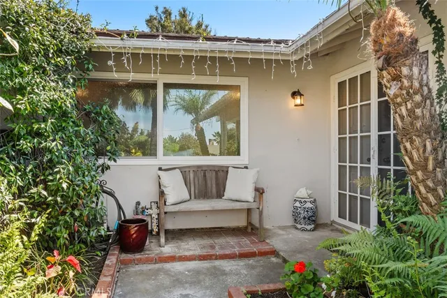 a view of a chair and table in the patio