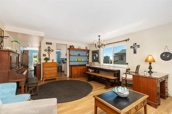 a living room with fireplace furniture and a table