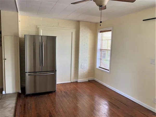a kitchen with stainless steel appliances a refrigerator and a stove top oven