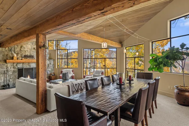 a view of a patio with table and chairs