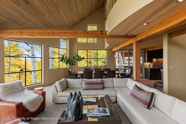 a view of a chairs and table in the balcony
