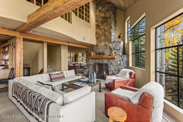 a living room with furniture and a table