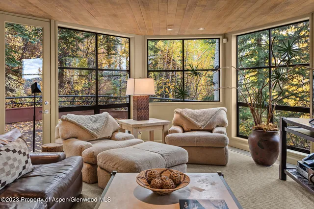 a bedroom with bed and a chandelier