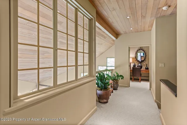 a bathroom with a granite countertop tub sink and a mirror