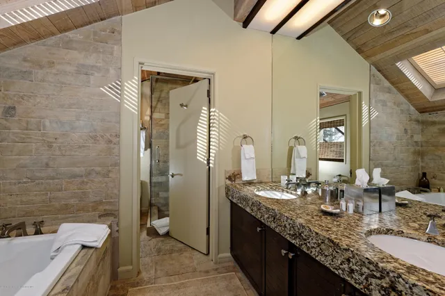 a bedroom with a bed and a lamp