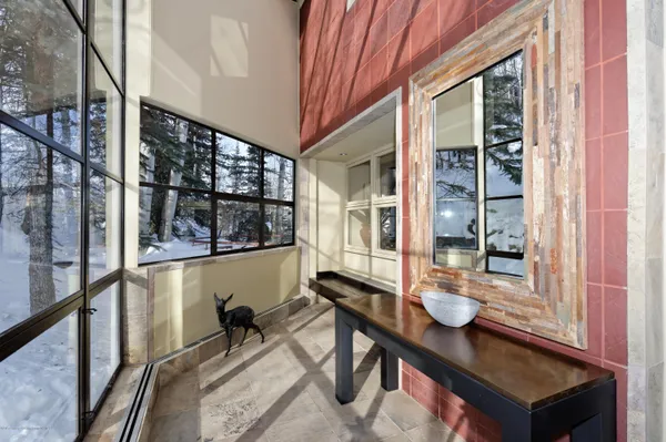 a kitchen with stainless steel appliances kitchen island granite countertop a sink and wooden cabinets