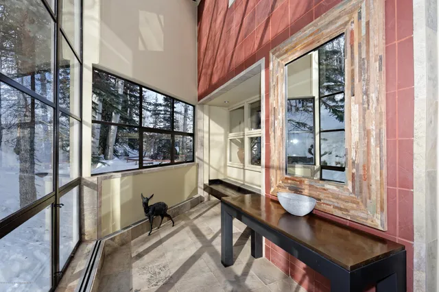 a kitchen with stainless steel appliances kitchen island granite countertop a sink and wooden cabinets