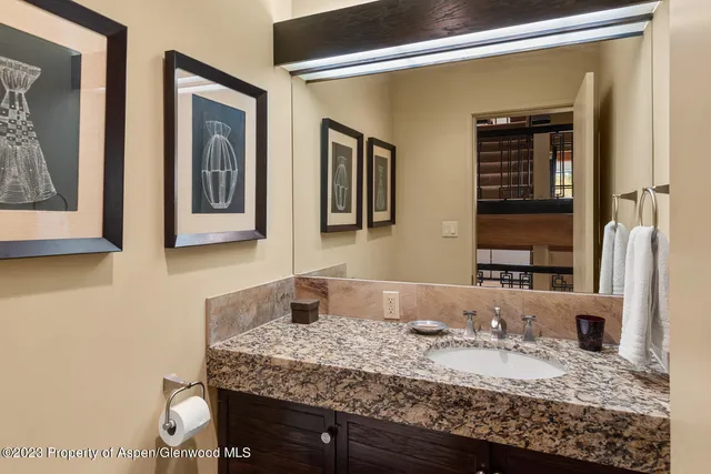 a large kitchen with stainless steel appliances granite countertop a stove and a sink