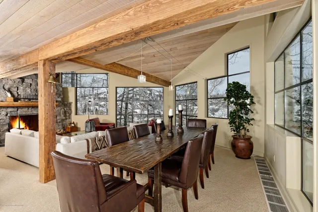 a view of a dining room with furniture window and outside view