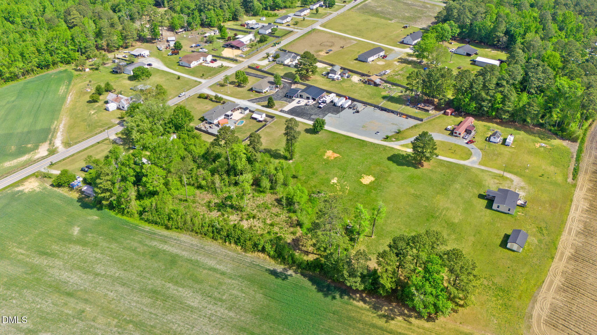 2115 Woods Crossroads Road Benson, NC 27504 - Photo 3 of 6 an aerial view of residential houses with outdoor space and street view