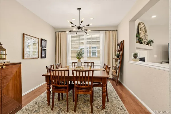 a view of a dining room with furniture window and wooden floor