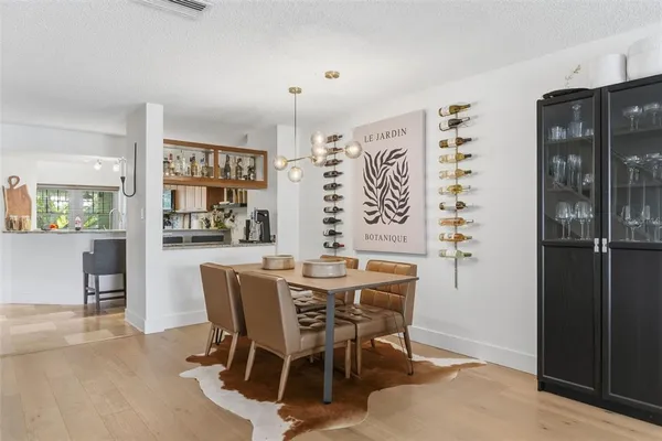a view of a dining room with furniture and window