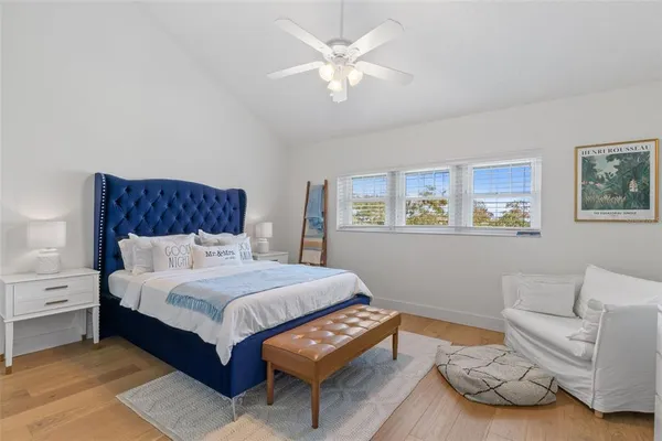 a bedroom with a bed and a couch