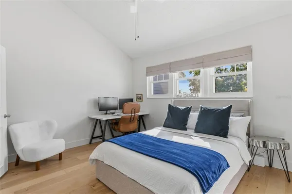 a bedroom with a bed and window