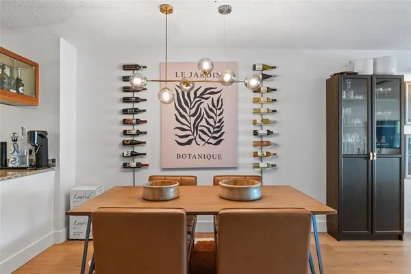 a room with stainless steel appliances a sink a refrigerator and washer