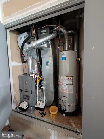 a view of a backyard with grass and a garage