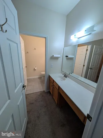 a bathroom with a double vanity sink and mirror