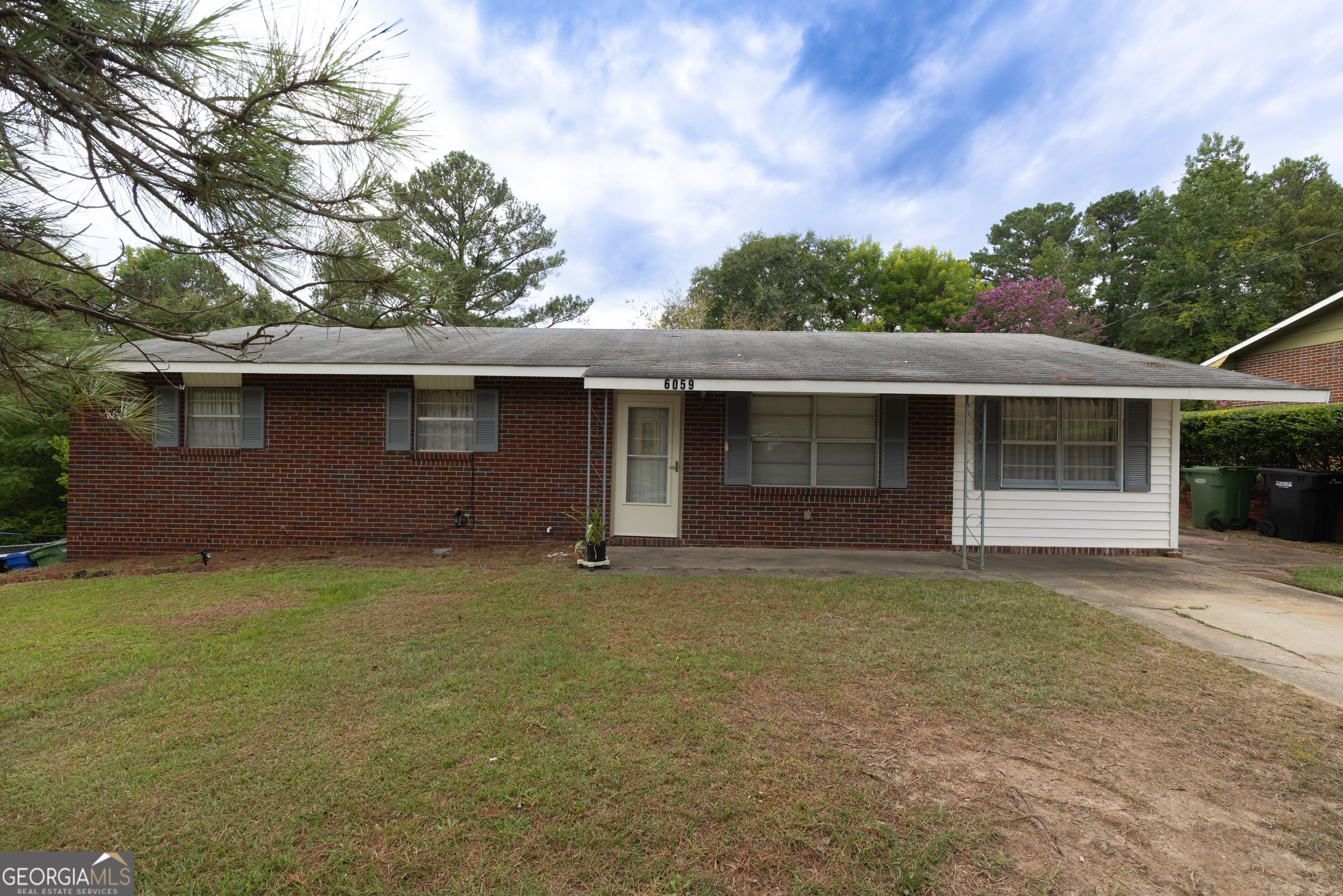 6059 Nassau Circle Columbus, GA 31907 - Photo 1 of 16 a front view of a house with garden