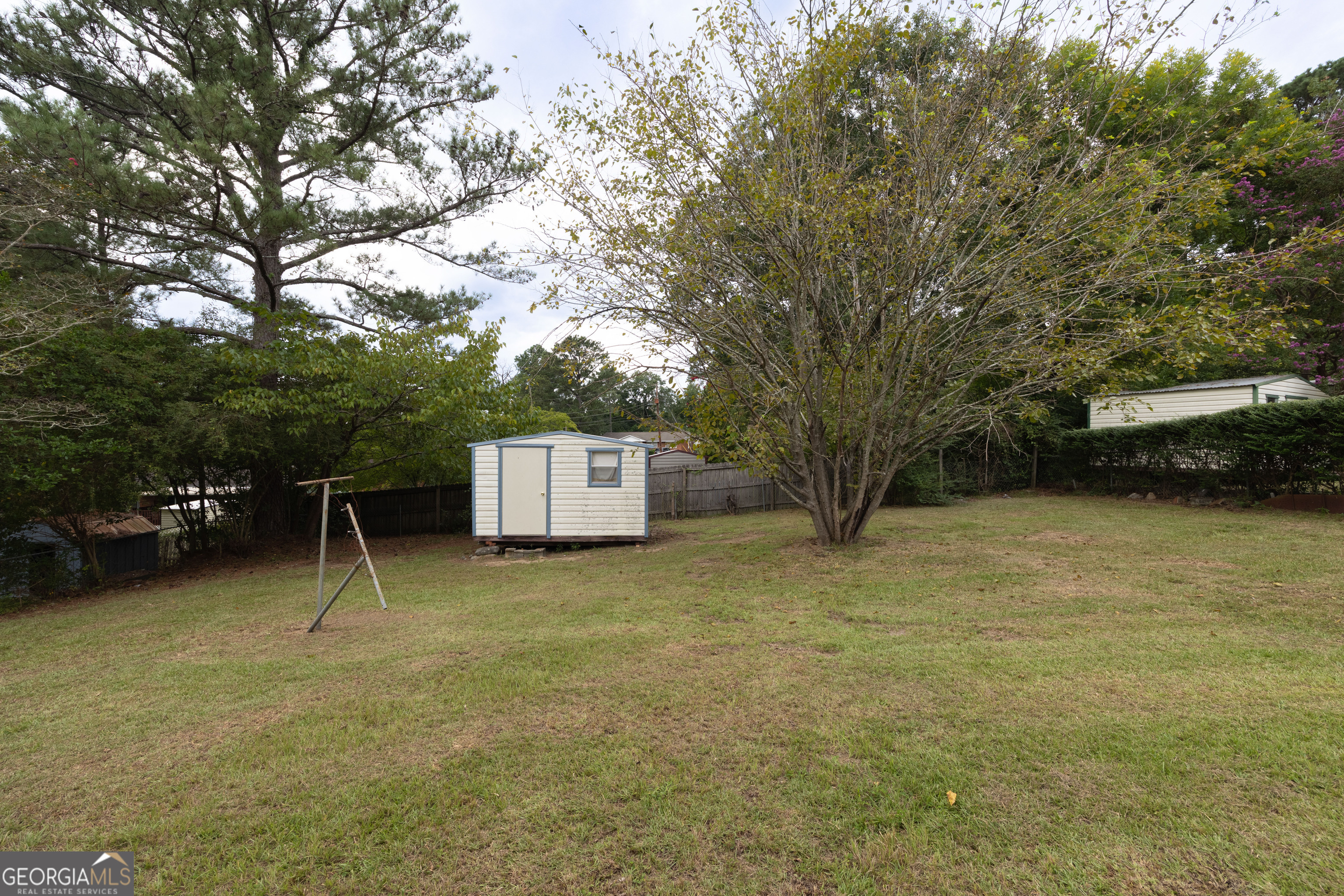 6059 Nassau Circle Columbus, GA 31907 - Photo 15 of 16 a view of a couches with wooden fence