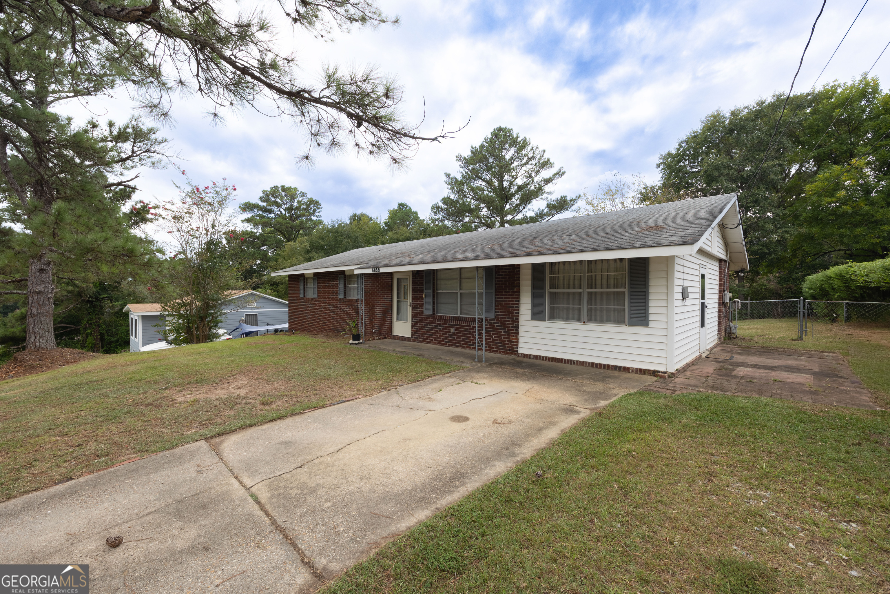 6059 Nassau Circle Columbus, GA 31907 - Photo 2 of 16 a front view of a house with a garden