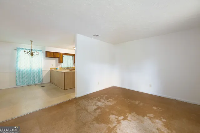 a view of a livingroom with a kitchen