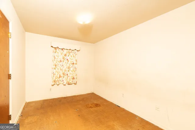 a view of a big room with a large window