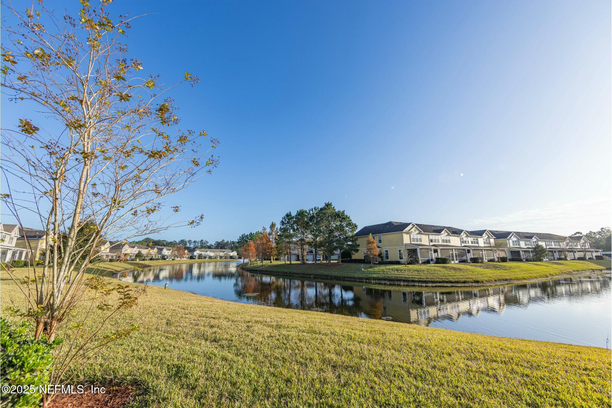 6862 Roundleaf Drive Jacksonville, FL 32258 - Photo 12 of 32 a view of a lake with boats and trees in the background