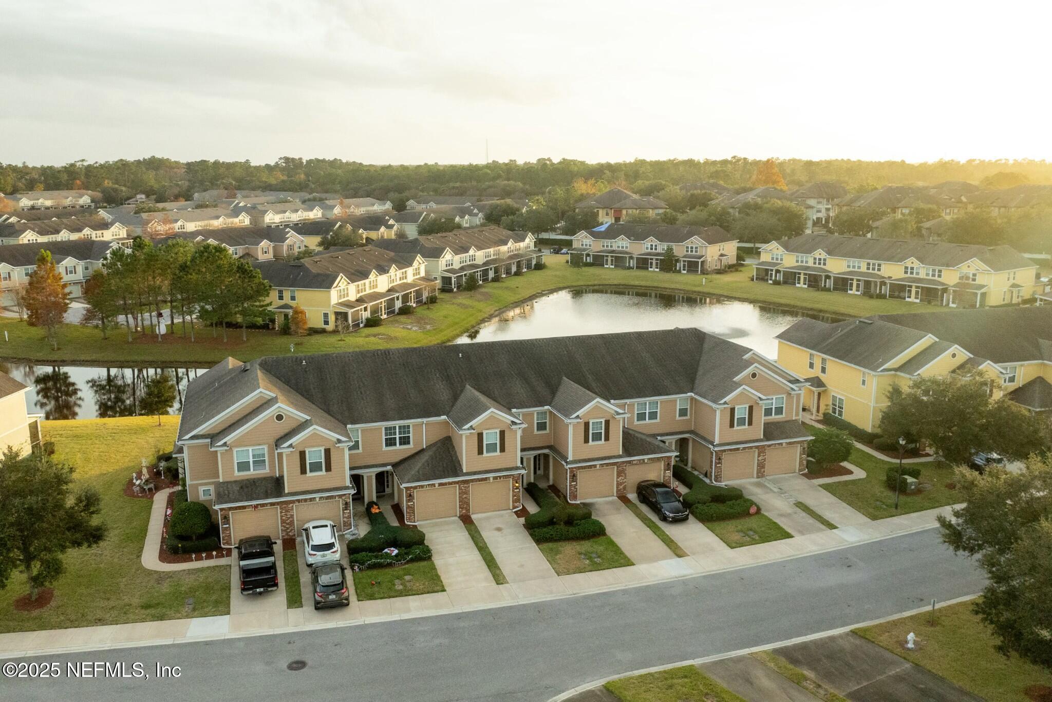 6862 Roundleaf Drive Jacksonville, FL 32258 - Photo 2 of 32 an aerial view of houses with a lake