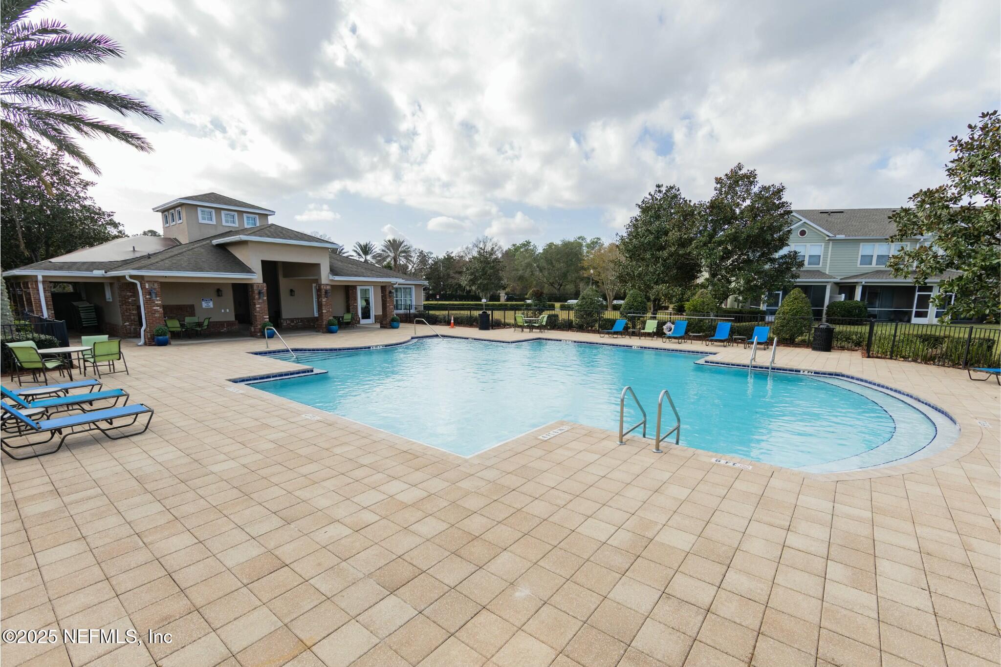 6862 Roundleaf Drive Jacksonville, FL 32258 - Photo 27 of 32 a swimming pool with outdoor seating and barbeque oven
