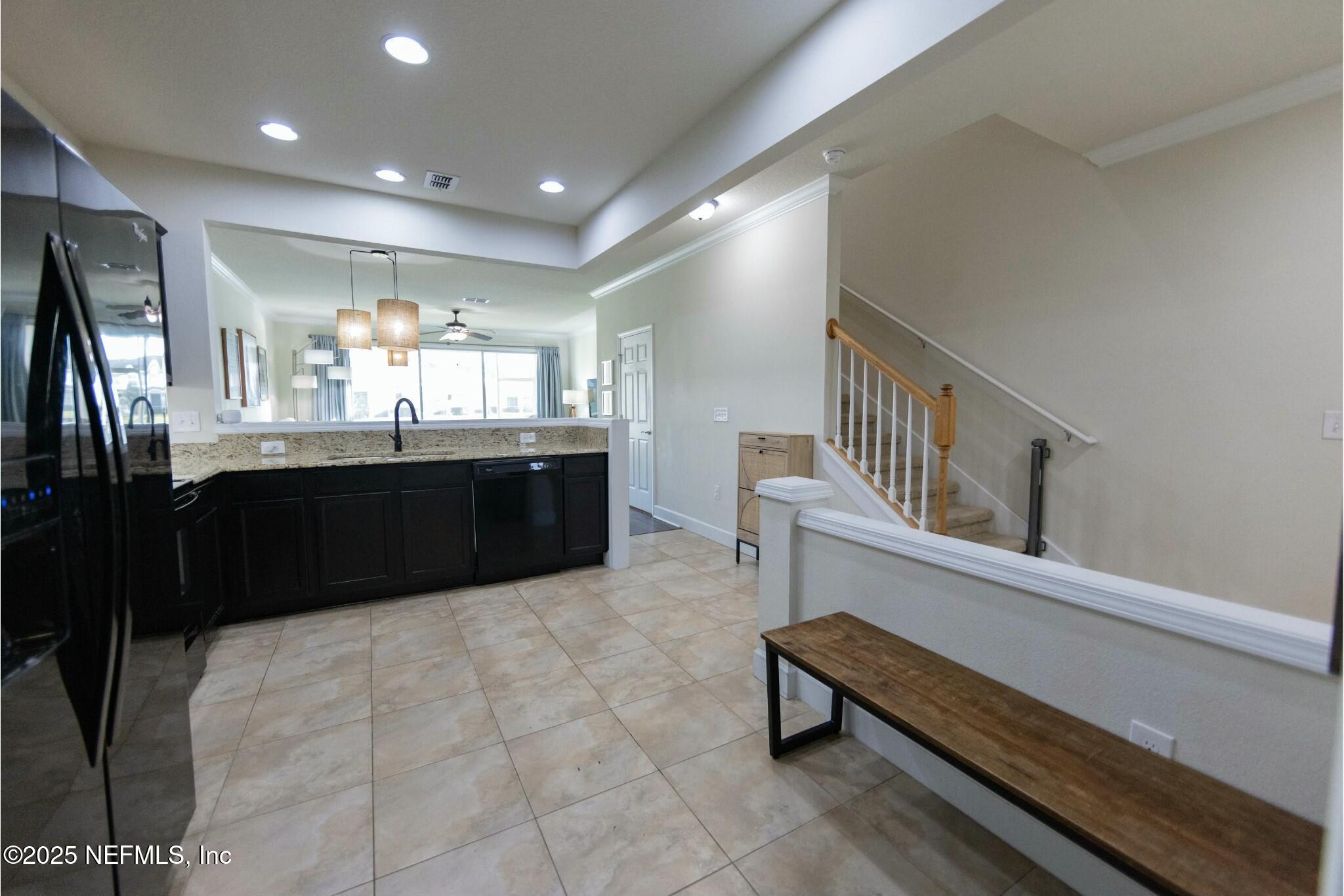 6862 Roundleaf Drive Jacksonville, FL 32258 - Photo 5 of 32 a kitchen with stainless steel appliances granite countertop a sink and a refrigerator
