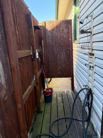 a view of balcony with wooden floor