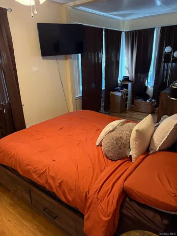 a bedroom with a bed and walk in closet