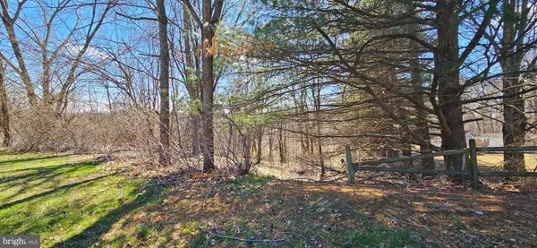 a view of swimming pool with outdoor seating and trees