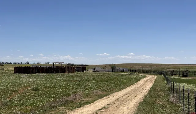 a view of a lake with a yard