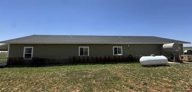 a house view with a backyard space