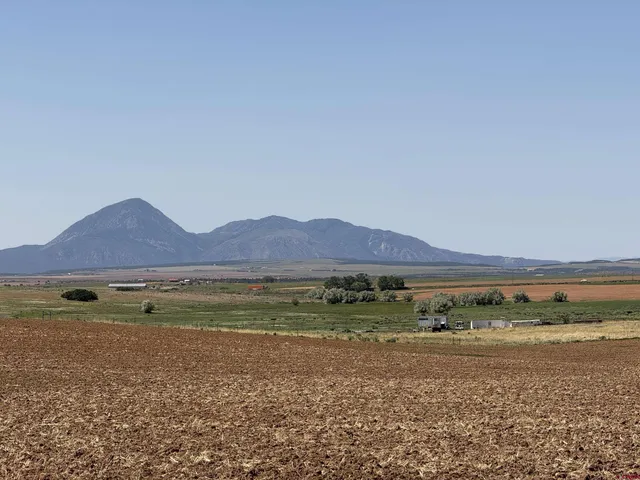a view of an ocean and a mountain